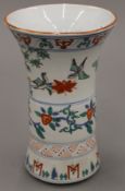 A Chinese porcelain polychrome decorated vase in Transitional/Late Ming style. 24 cm high.