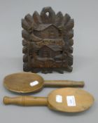 A Blackforest letter rack and two wooden spoons. The former 22 cm high.