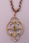 An Art Nouveau 9 ct gold pendant on chain. Pendant 2.5 cm high, chain approximately 38 cm long. 6.