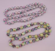 Two strings of Venetian glass beads. Each approximately 76 cm long.