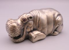 A silver model of a hippopotamus bearing Russian marks. 8 cm long. 76.7 grammes total weight.
