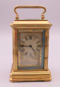 A Sevres style miniature carriage clock. 8 cm high.