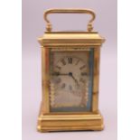 A Sevres style miniature carriage clock. 8 cm high.