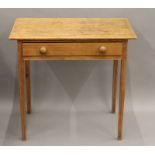 A 19th century pine single drawer table. 78 cm wide.