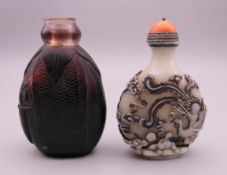 Two Chinese snuff bottles, one decorated as an elephant. Tallest 7.5 cm high.