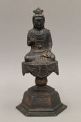 A bronze model of Buddha. 28 cm high.