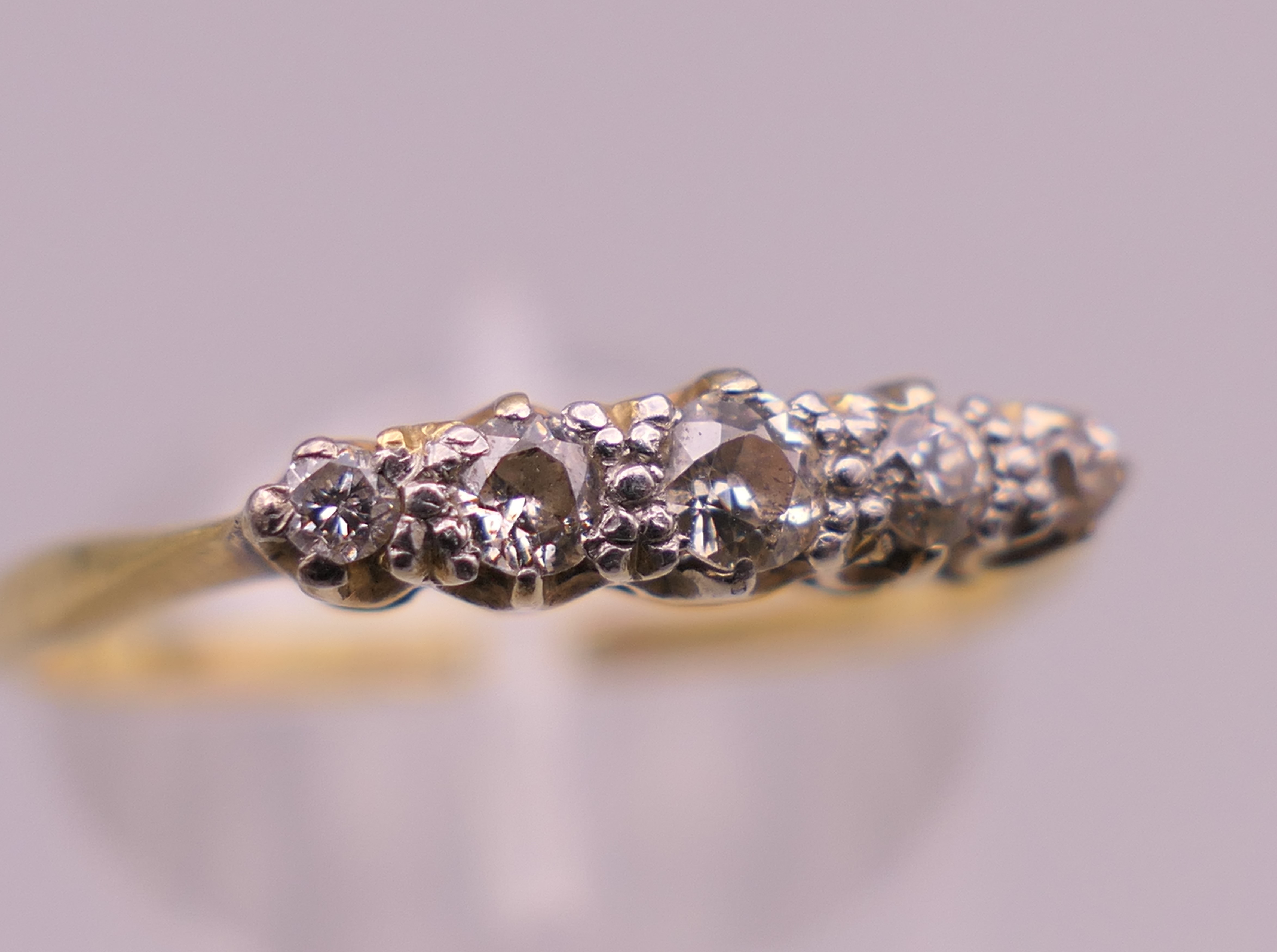 An 18 ct gold five stone diamond ring. Ring P/Q. 1.9 grammes total weight. - Image 3 of 5