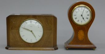An Edwardian inlaid mahogany mantle clock and a time saving clock. The former 23 cm high.