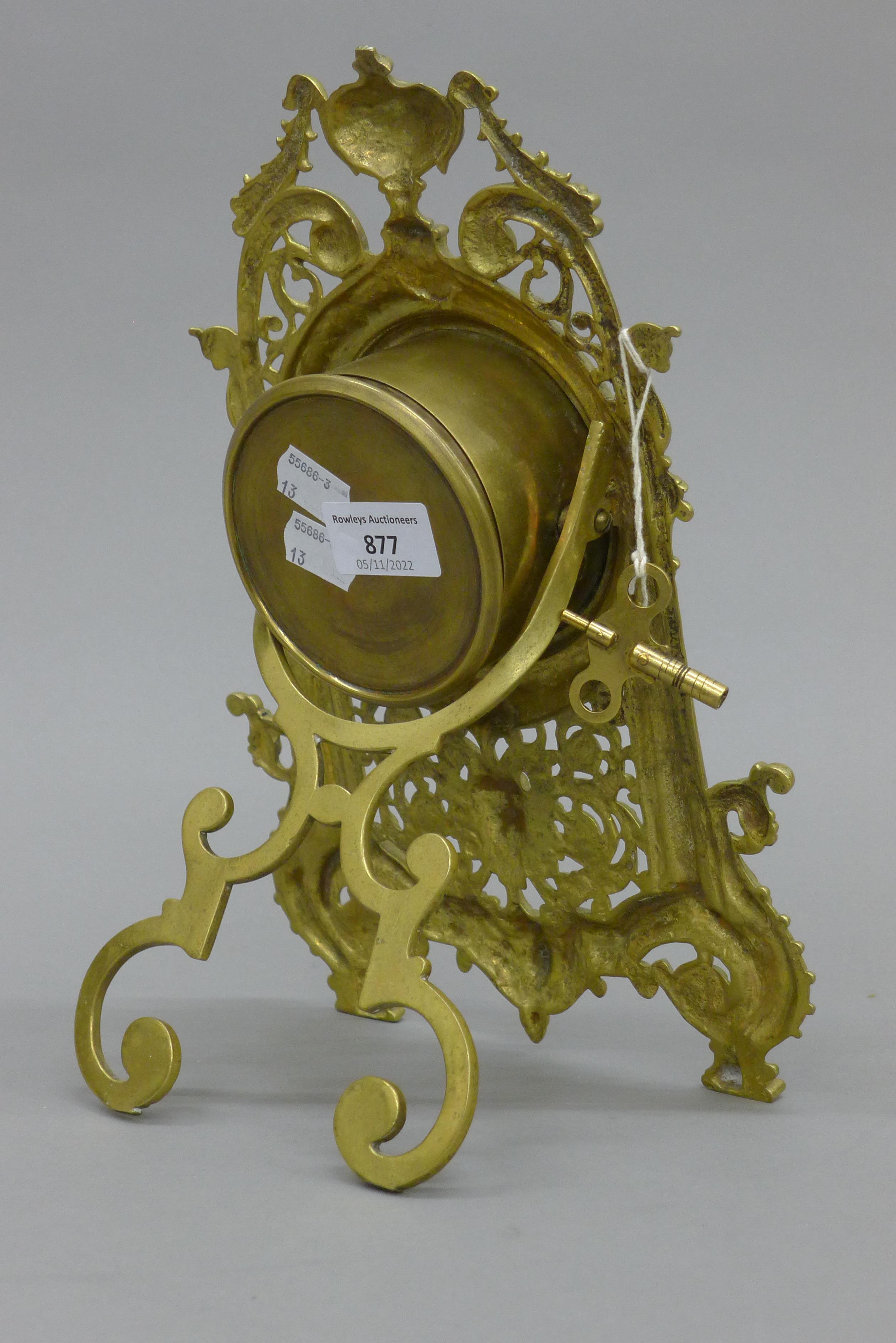 A brass strutt clock. 32 cm high. - Image 3 of 4