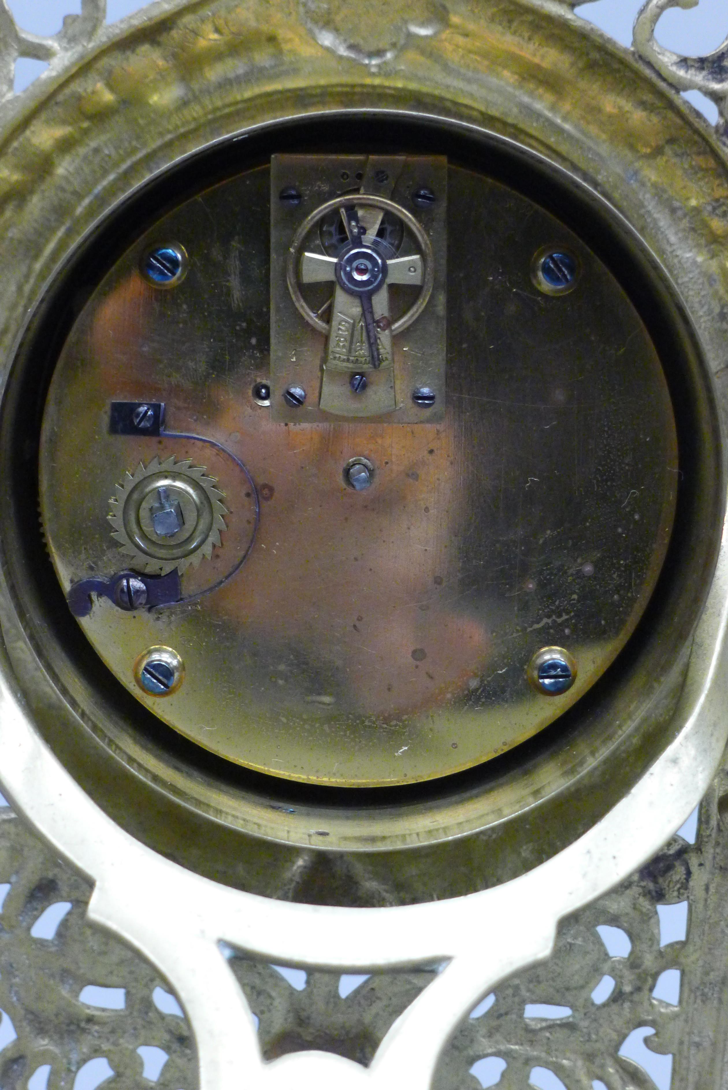 A brass strutt clock. 32 cm high. - Image 4 of 4