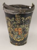 A leather fire bucket decorated with the Royal Crest. 39 cm high.