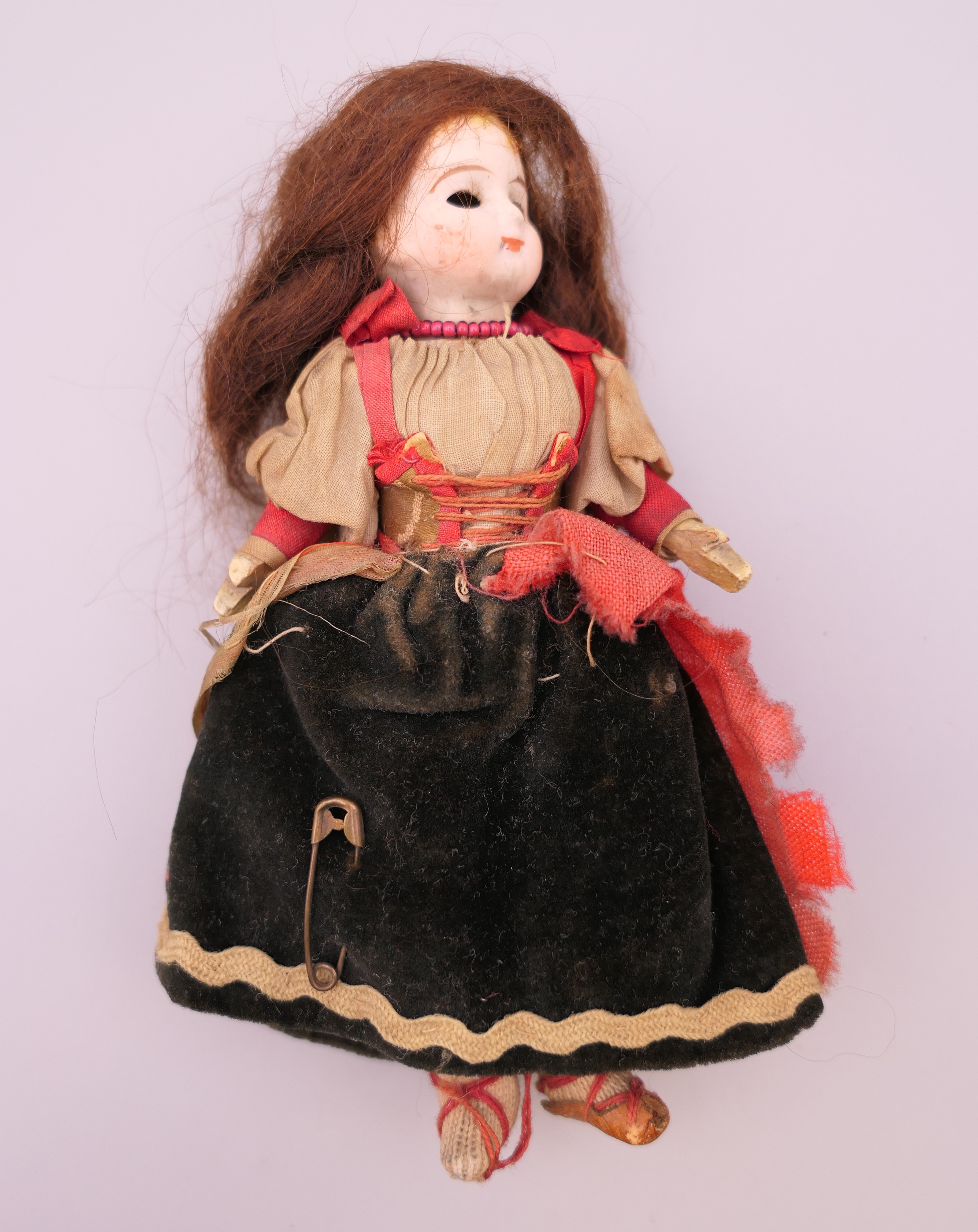 A 19th century miniature bisque headed doll. 13 cm high. - Image 2 of 9