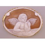 An 18 ct gold cameo brooch depicting cupid. 5.5 cm x 4 cm.
