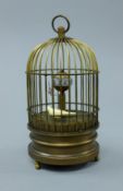 A bird cage clock. 15 cm high.