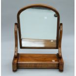 A Victorian mahogany toilet mirror. 54 cm wide.