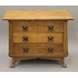 An Arts and Crafts oak dressing table base. 99 cm wide.