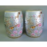 A pair of silvered barrel stools decorated with birds. 45 cm high.