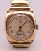 A vintage Tudor gentlemen's 9 ct gold wristwatch on later metal strap. 3 cm wide.