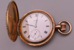 A Waltham gold plated pocket watch. 4.25 cm diameter.