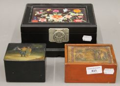 A papier mache box and two other boxes. The former 10 cm wide.