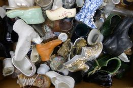 A collection of various porcelain shoes, a Portmeirion storage jar, etc.