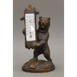 A 19th century carved Blackforest bear form thermometer. 29 cm high.
