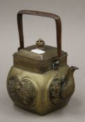 A 19th century Oriental teapot. 18.5 cm high overall.
