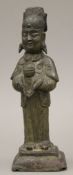 A Chinese Ming Dynasty bronze figure of an attendant. 21.5 cm high.