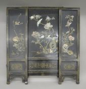 An Oriental hardstone mounted three piece screen. 102 cm wide overall x 91.5 cm high.