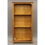 A modern pine bookcase. 95 cm wide x 184 cm high.