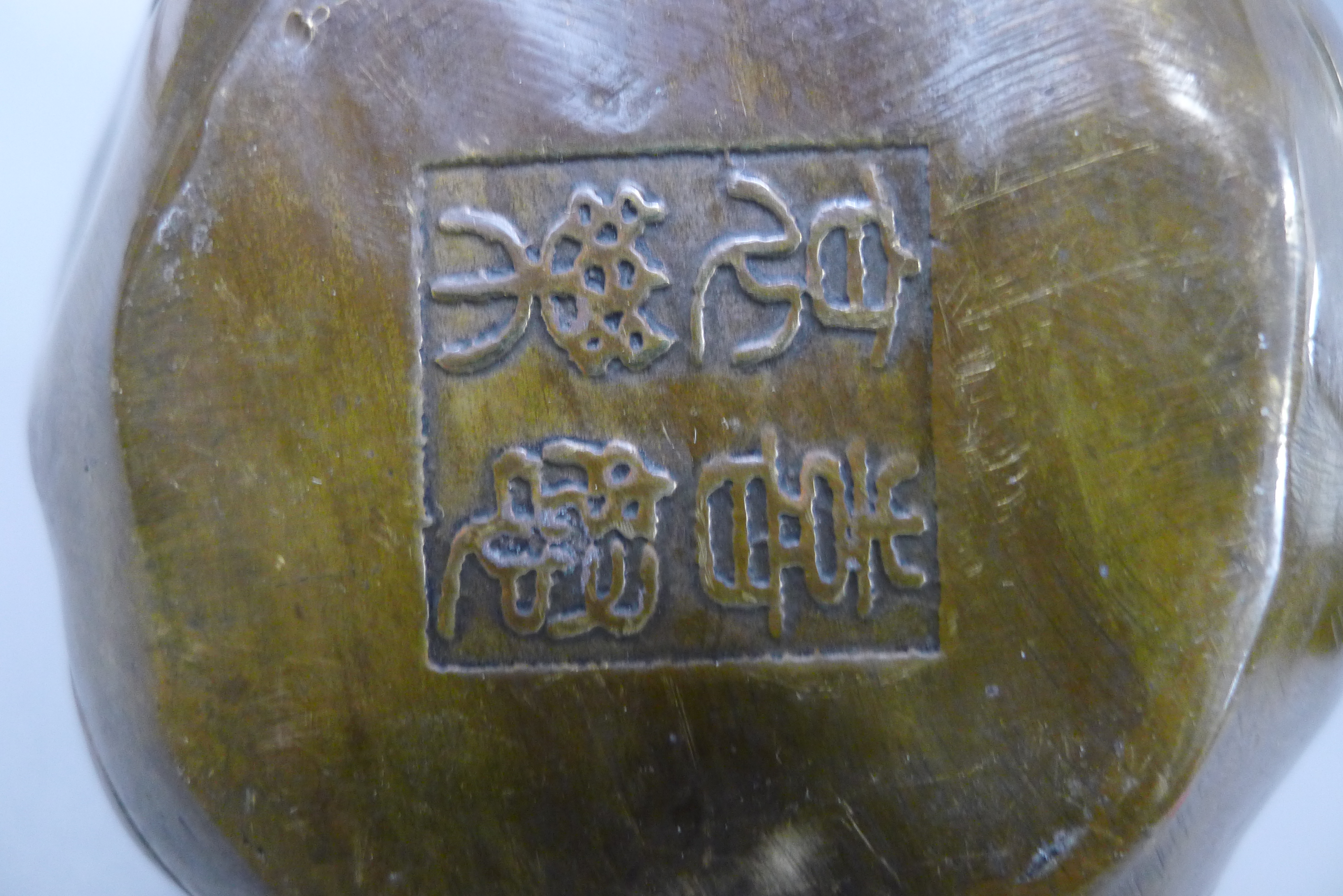 A brass four faced buddha head. 10.5 cm high. - Image 4 of 4