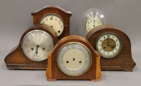 Four mantle clocks and an anniversary clock.