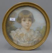 A Portrait of a Girl, pencil and pastel, framed and glazed. 33.5 cm diameter overall.