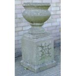 A composition garden urn on pedestal. 94 cm high.