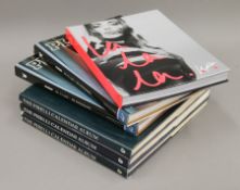 A quantity of various books, including The Pirelli Calendar Album,