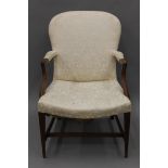 A 19th century upholstered open arm chair. 65 cm wide.