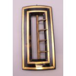 An unmarked gold inlaid tortoiseshell buckle. 7.5 cm x 3.75 cm.