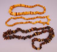 Three strings of amber. 44 cm long. 52 cm long, 86 cm long.