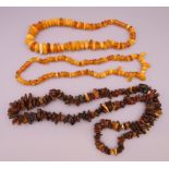 Three strings of amber. 44 cm long. 52 cm long, 86 cm long.