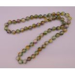 A string of large jade beads. Approximately 88 cm long.