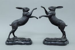 A pair of bronze boxing hares. 29.5 cm high.