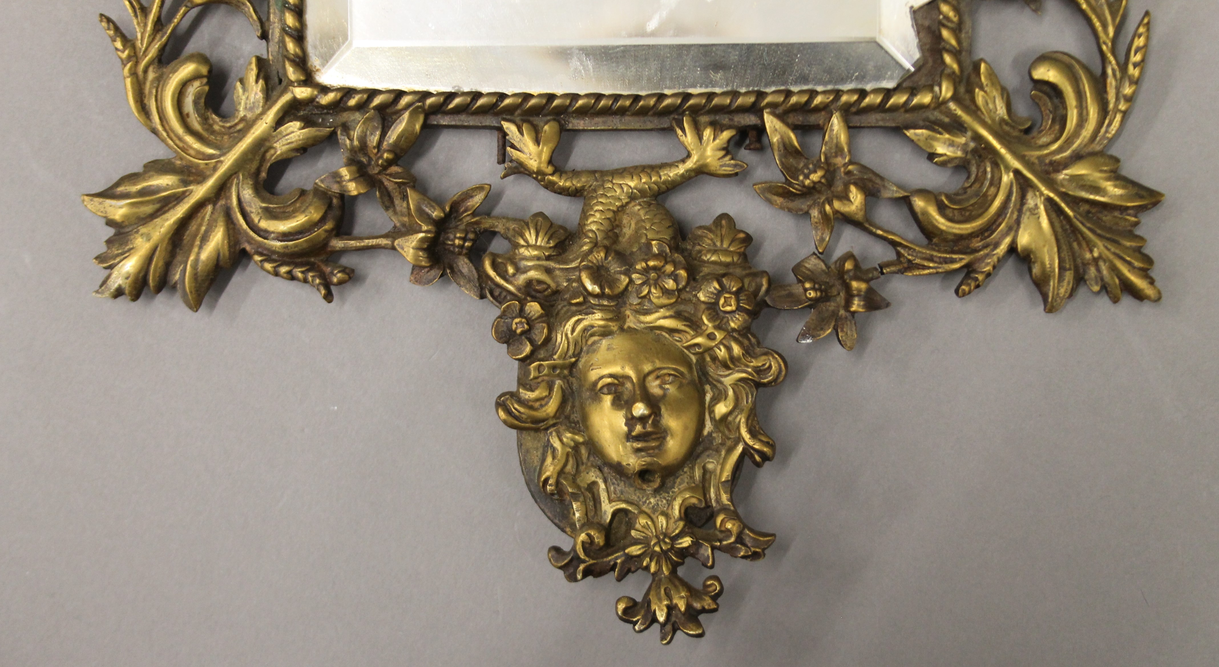 A brass framed mirror. 43 cm high. - Image 3 of 3