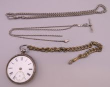 A silver pocket watch and a quantity of various chains. Watch 5.25 cm diameter.
