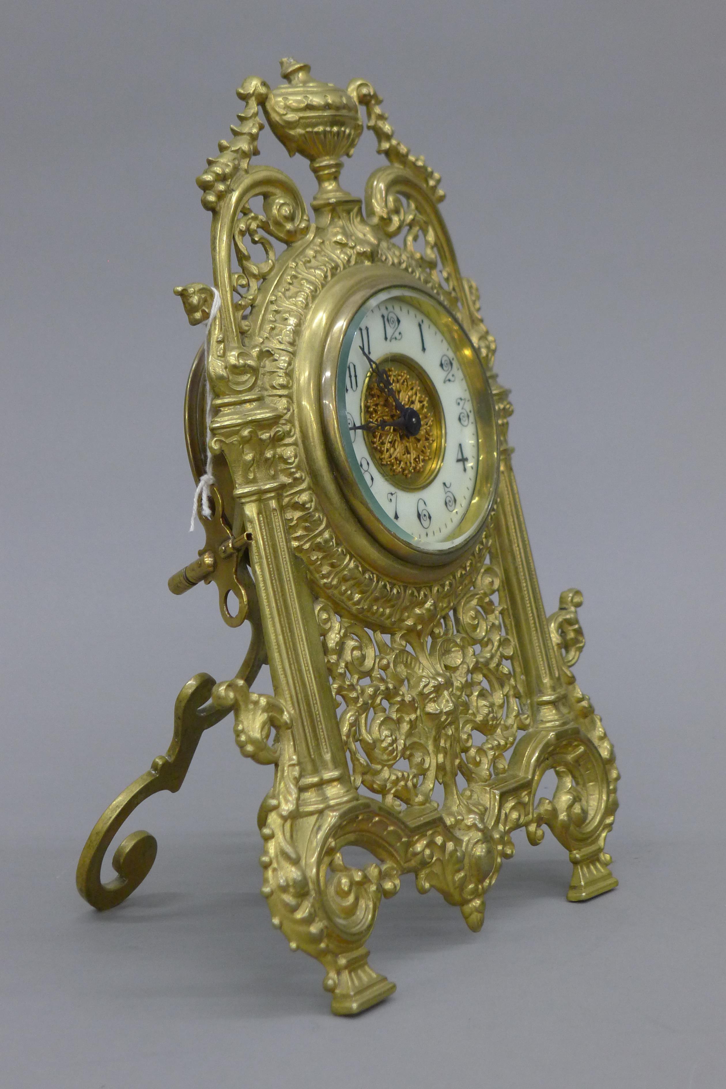 A brass strutt clock. 32 cm high. - Image 2 of 4