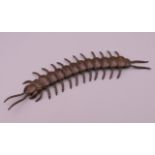 A bronze model of an articulated centipede. 16 cm long.