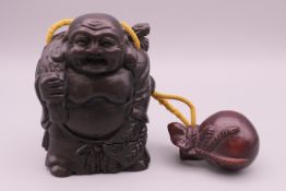 An inro formed as buddha. 8.5 cm high.