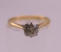 An 18 ct gold diamond solitaire ring, the claw set stone spreading approximately to .50 carat..