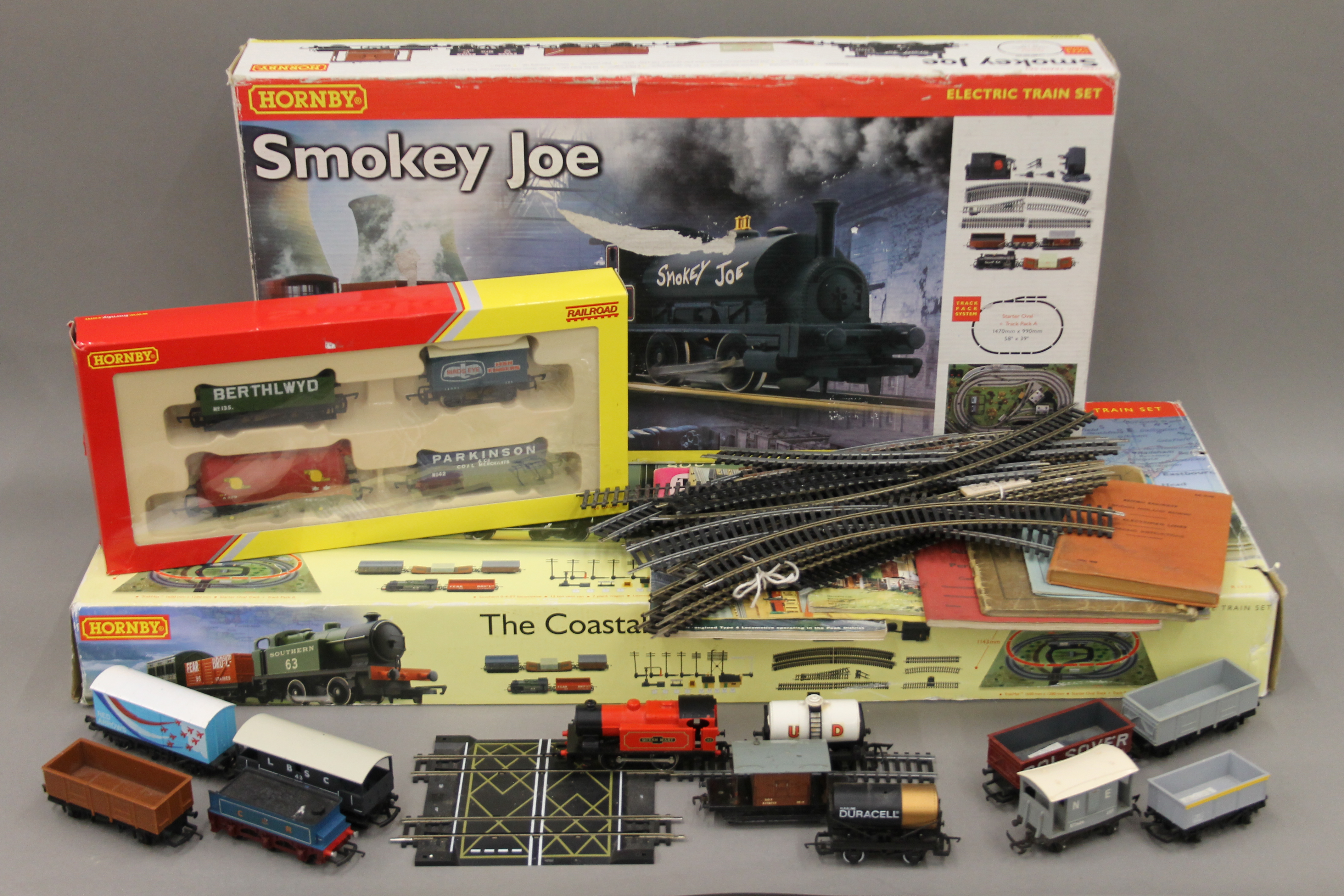 Two boxed Hornby OO Gauge train sets, a quantity of loose rolling stock and track,