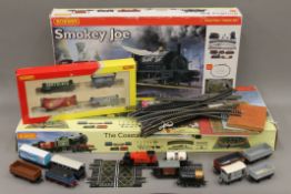 Two boxed Hornby OO Gauge train sets, a quantity of loose rolling stock and track,