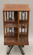 An Edwardian mahogany revolving bookcase. 38 cm square.